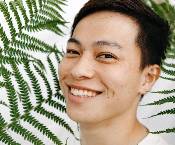 Person meditating peacefully in a bright, clean environment.